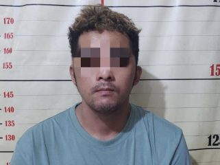 Tersangka RJ (25) usai diamankan aparat polisi. (Istimewa)
