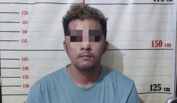 Tersangka RJ (25) usai diamankan aparat polisi. (Istimewa)