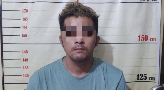 Tersangka RJ (25) usai diamankan aparat polisi. (Istimewa)